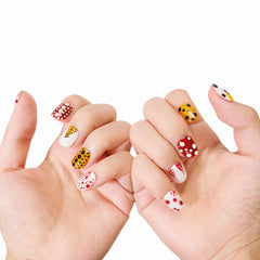 Hand model showcasing Polka Dot Fever press-on nails from Snaps Chic